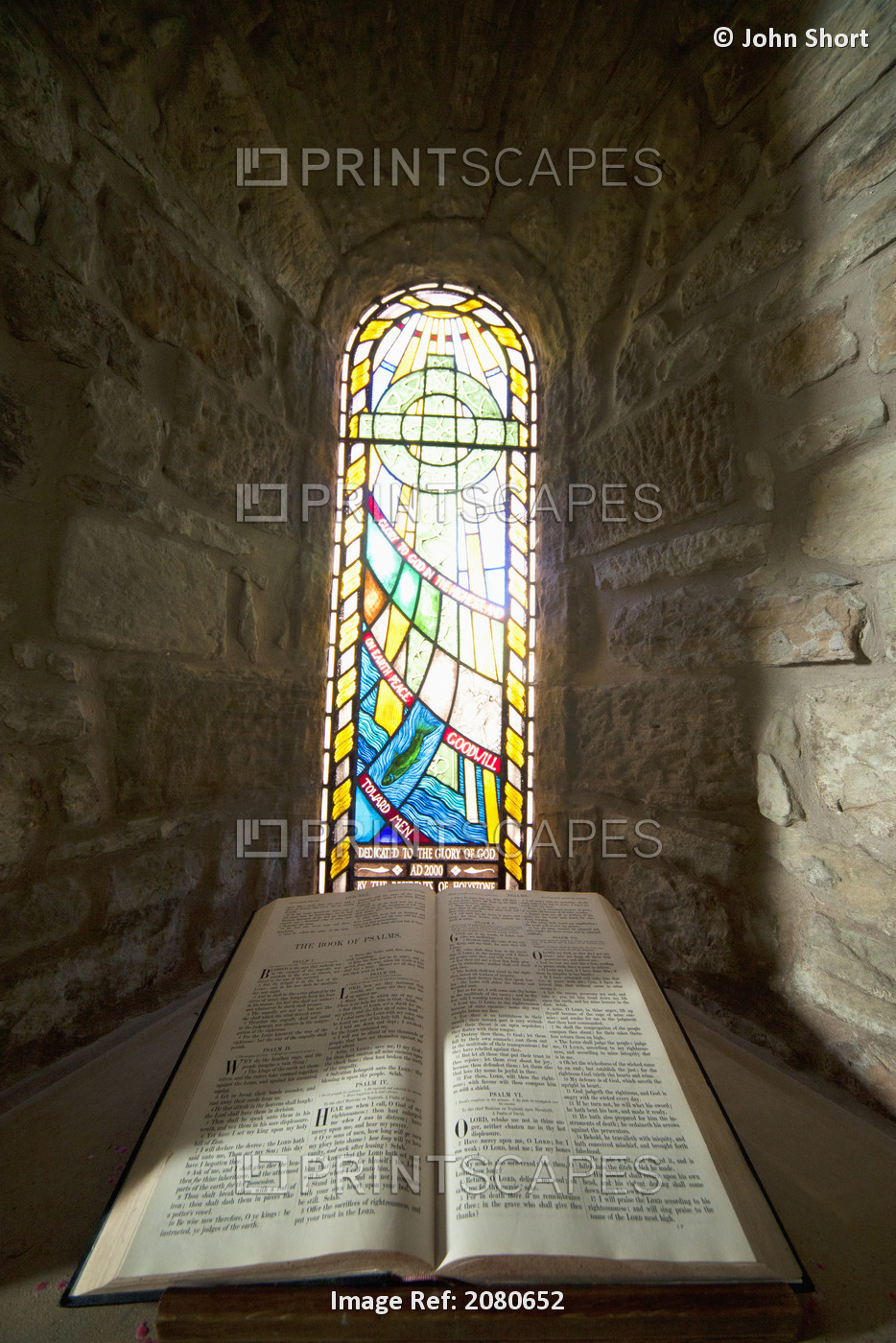 An Open Bible And A Stained Glass Window In St. Mary's Church; Holystone, ...