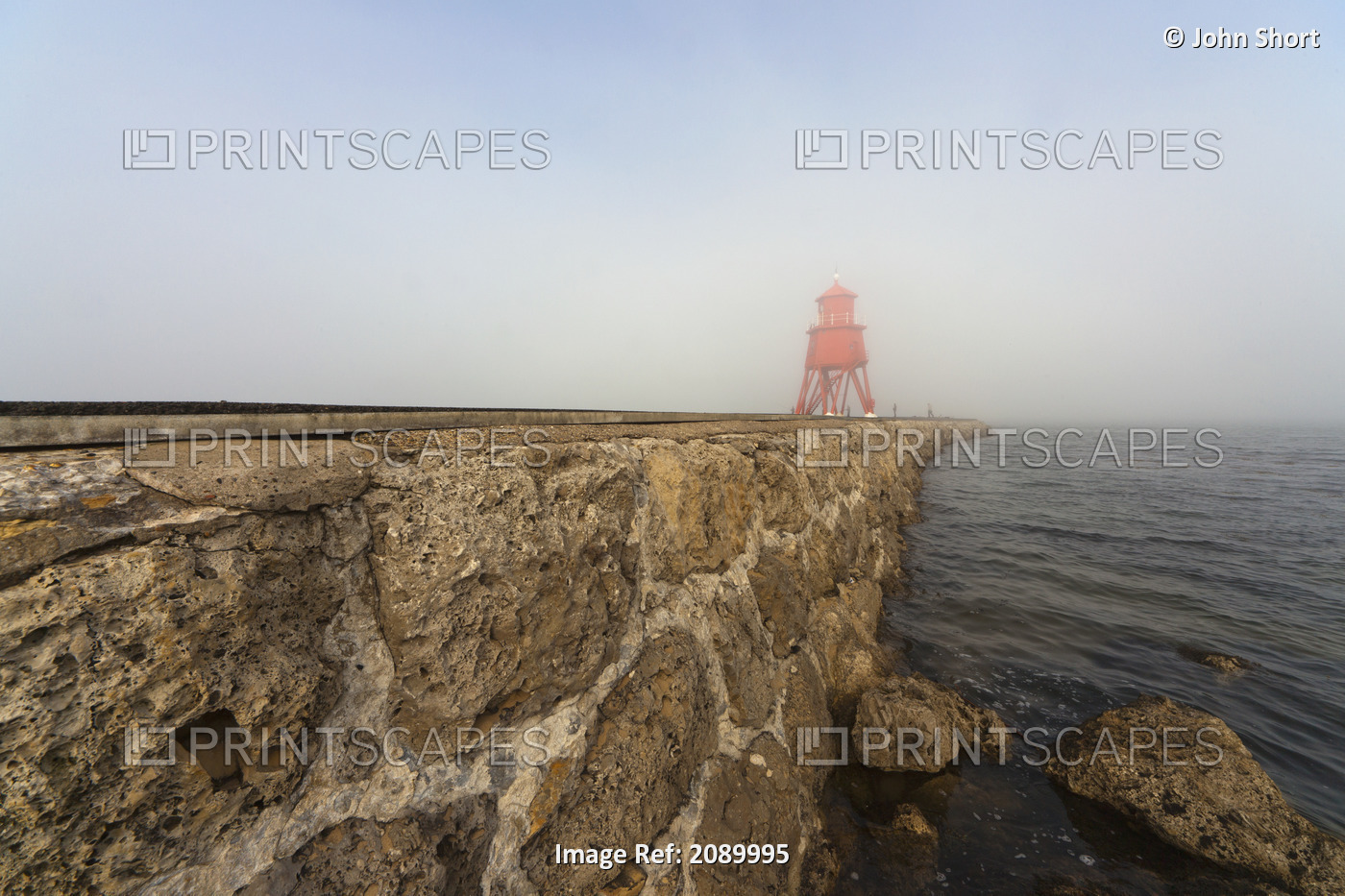 Red lighthouse in the fog on the coast;South shields tyne and wear england