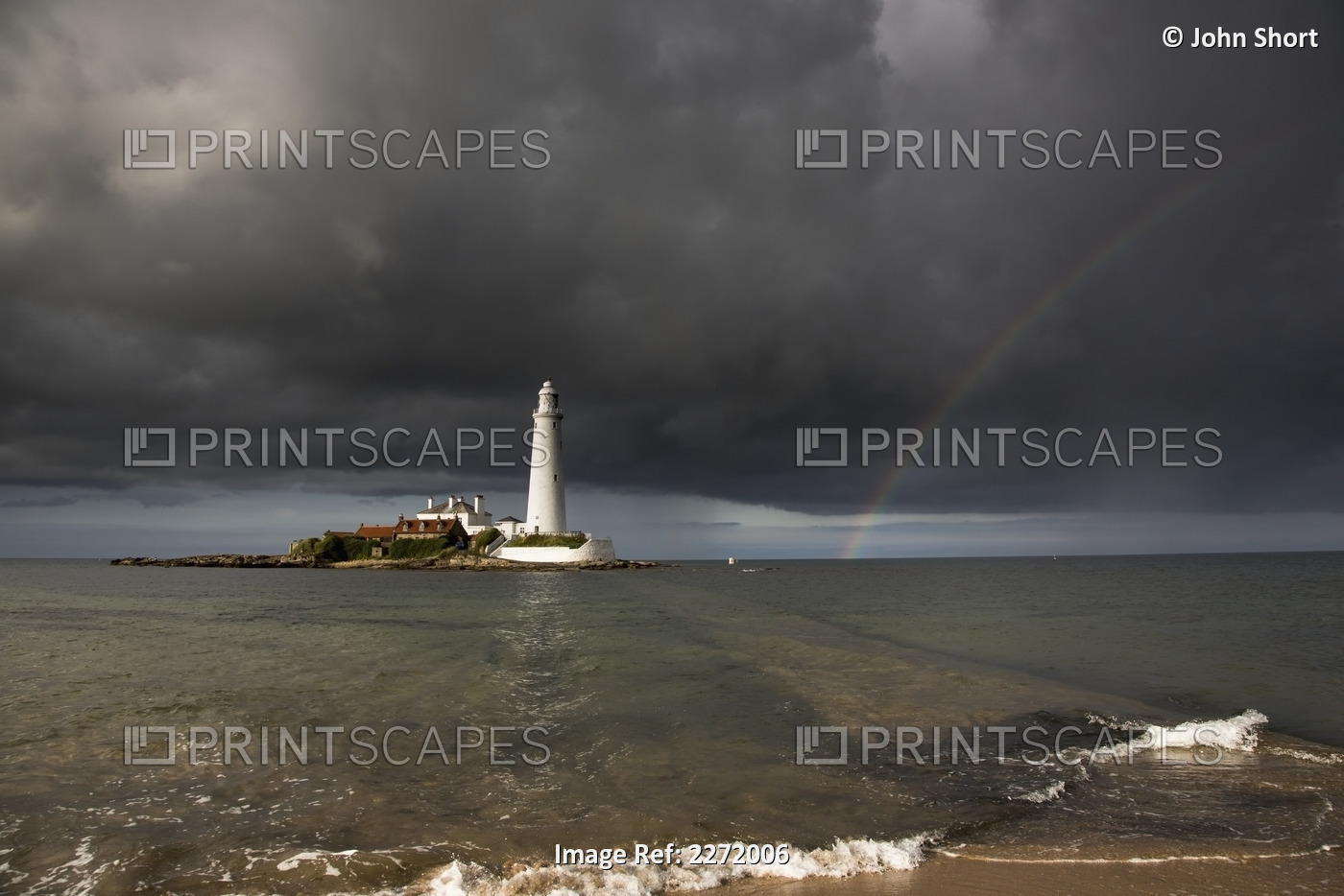 White Lighthouse Illuminated By Sunlight Under A Dark Stormy Sky With A ...