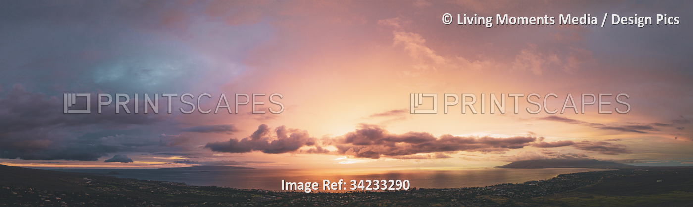 Panoramic view of the glowing pink sky at sunset over the Pacific Ocean from ...